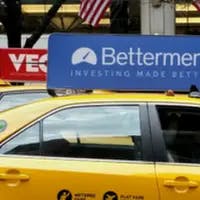 Betterment has gone from placards atop NYC cabs to fusion with Uber's ubiquitous mobile app.